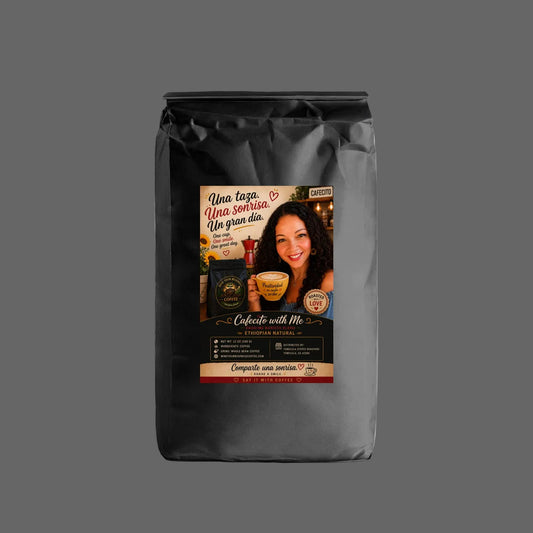 A black bag of coffee with a colorful front label featuring a smiling woman and Spanish text, photographed on a clean white background.